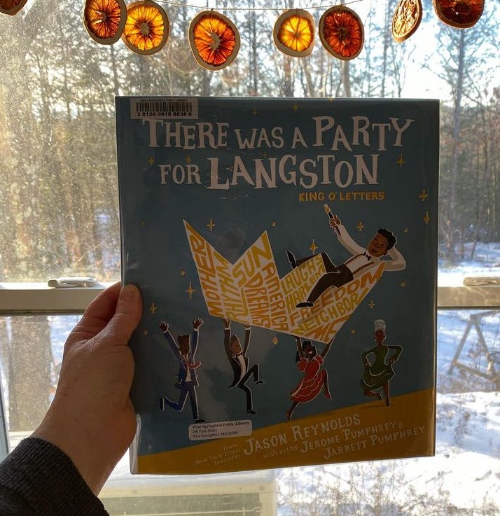 I’m holding up this book in my sunny window, below a garland of dried orange slices filtering the sunlight.